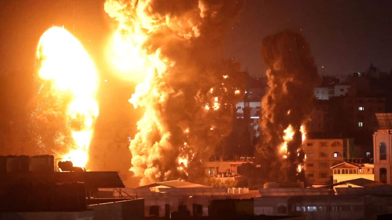 Fire and smoke rises above Gaza City as Israeli warplanes target the Palestinian enclave, early on 17 May, 2021.