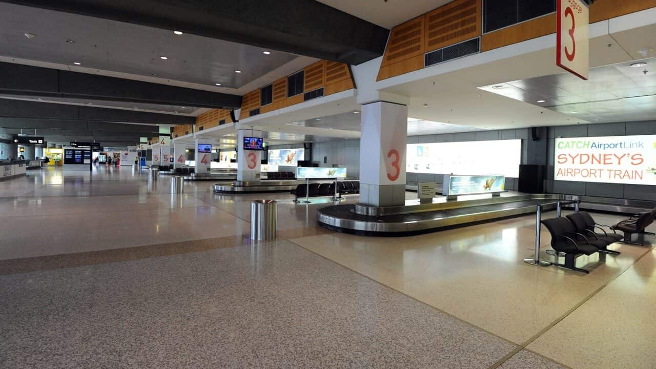 A deserted arrivals area at Sydney airport due to flight cancellations