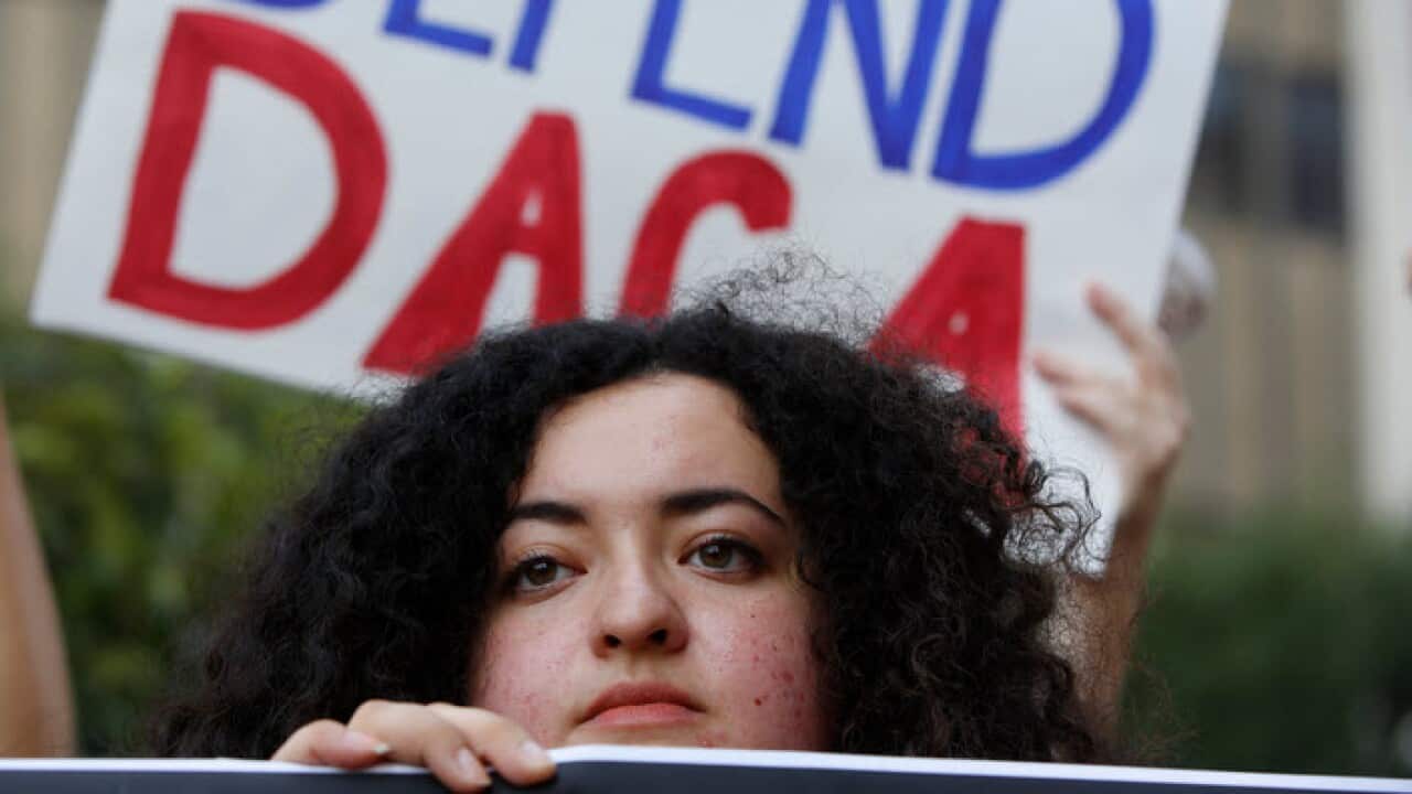 Protesters call on Donald Trump to keep program protecting young undocumented immigrants from deportation.
