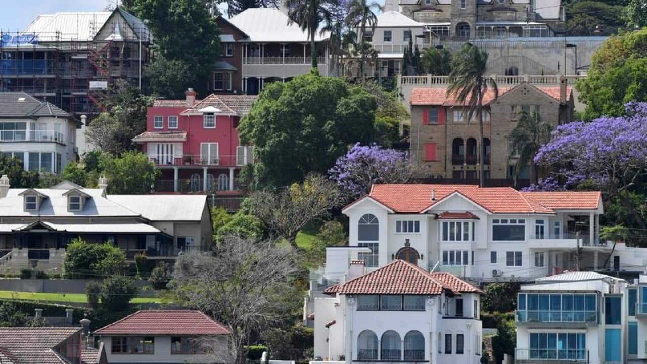 Houses and apartment buildings are seen in the Brisbane