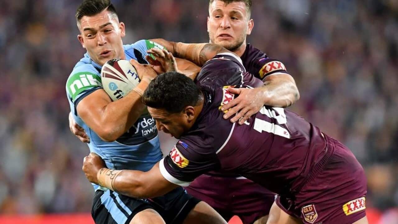 Nick Cotric of the Blues is tackled