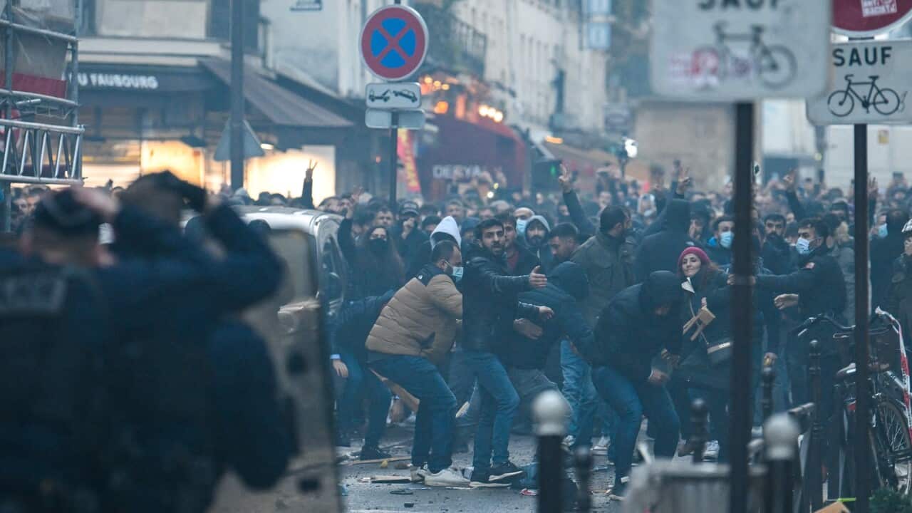 Protesters clash with riot police in Paris.