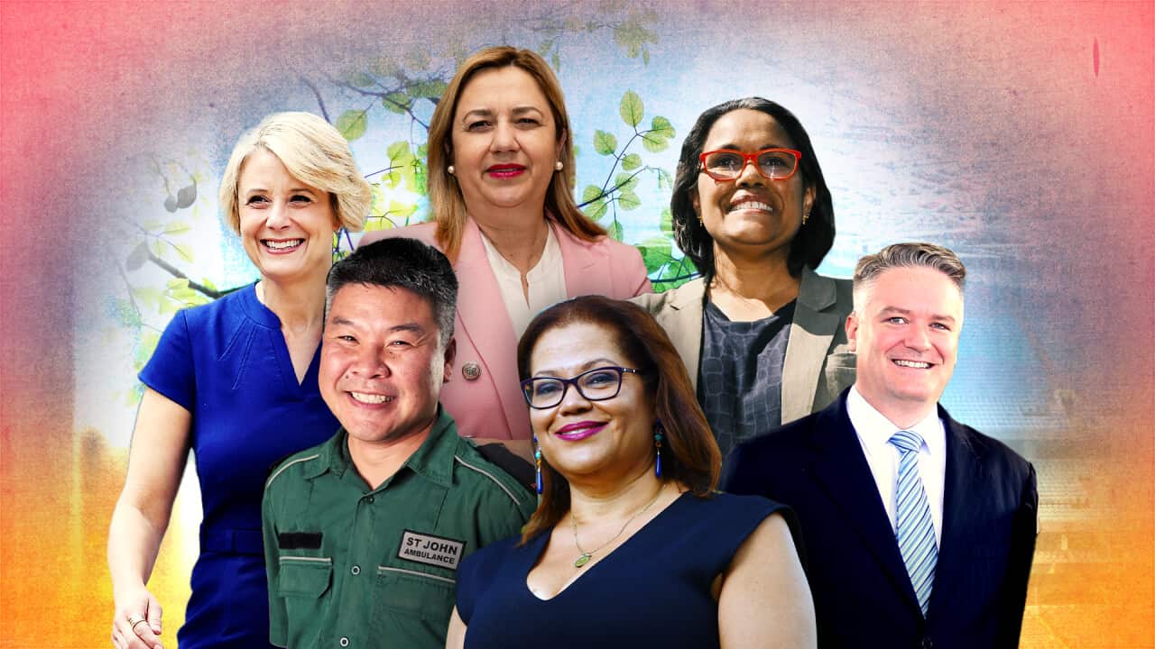 Group portrait of seven adults smiling, arranged in two rows against a colourful background with soft gradients and leafy illustrations. The group includes men and women of diverse backgrounds, wearing a mix of professional attire and a St John Ambulance uniform