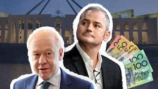 Two men against the backdrop of parliament.