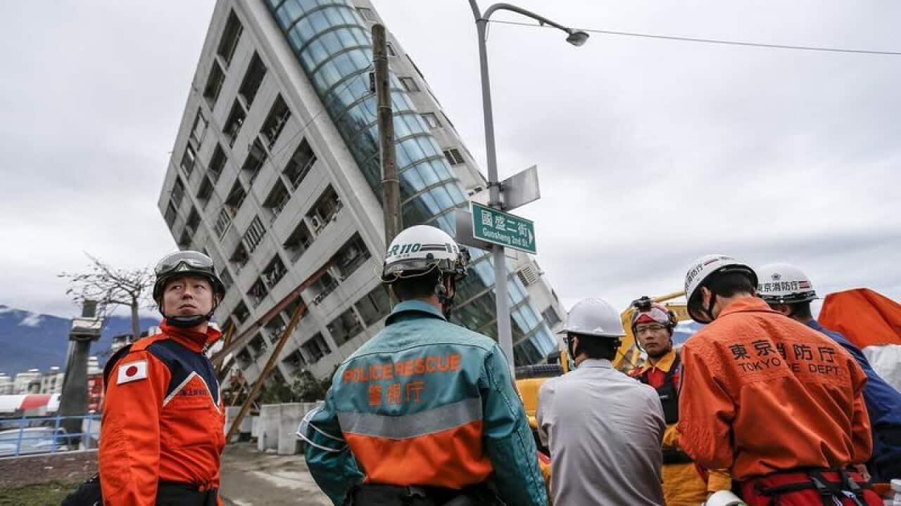 Rescuers outside a building in Hualien, eastern Taiwan