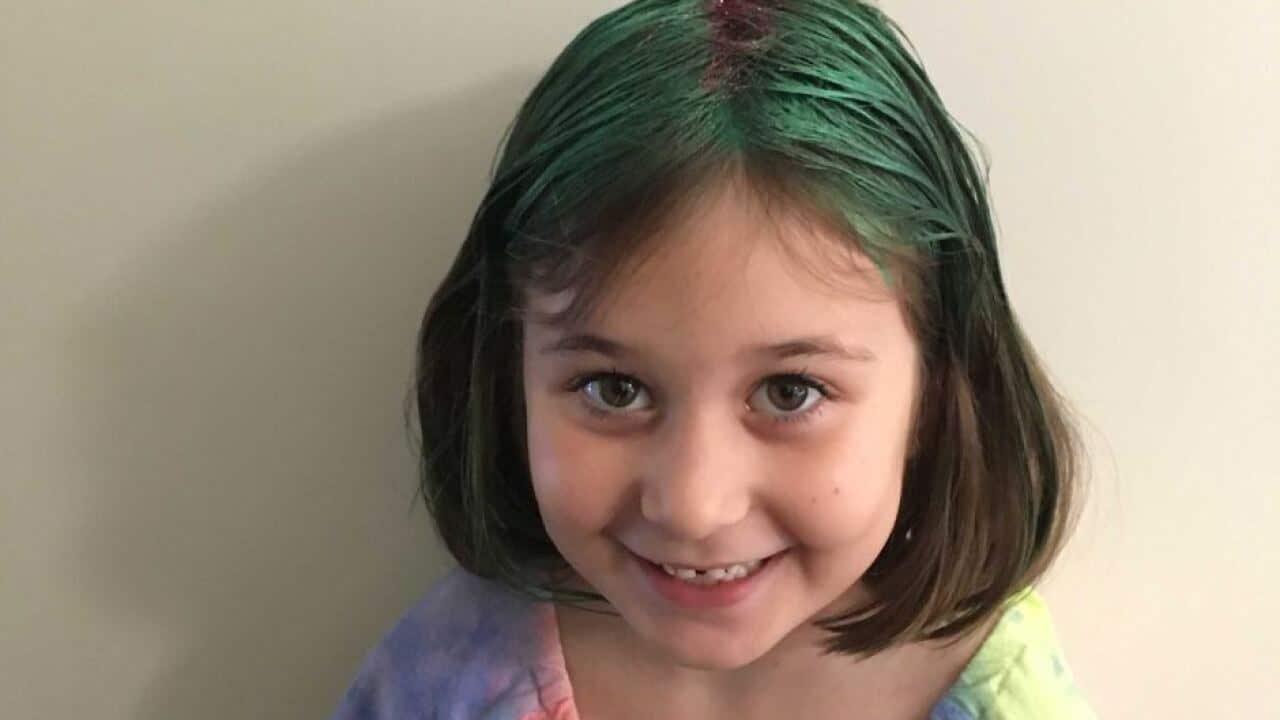 Lilee is described as being Caucasian and wearing a navy blue tutu dress and no shoes.