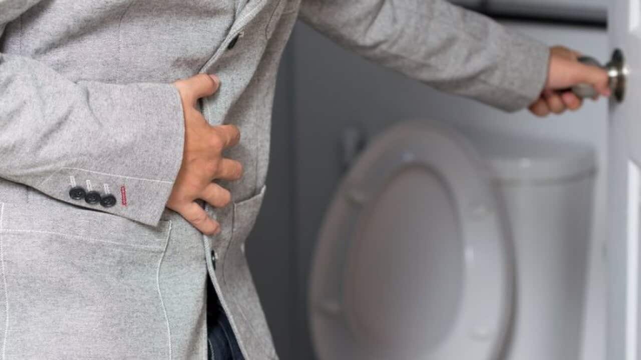 A man holding his penis with on the. Wants to go to the toilet.