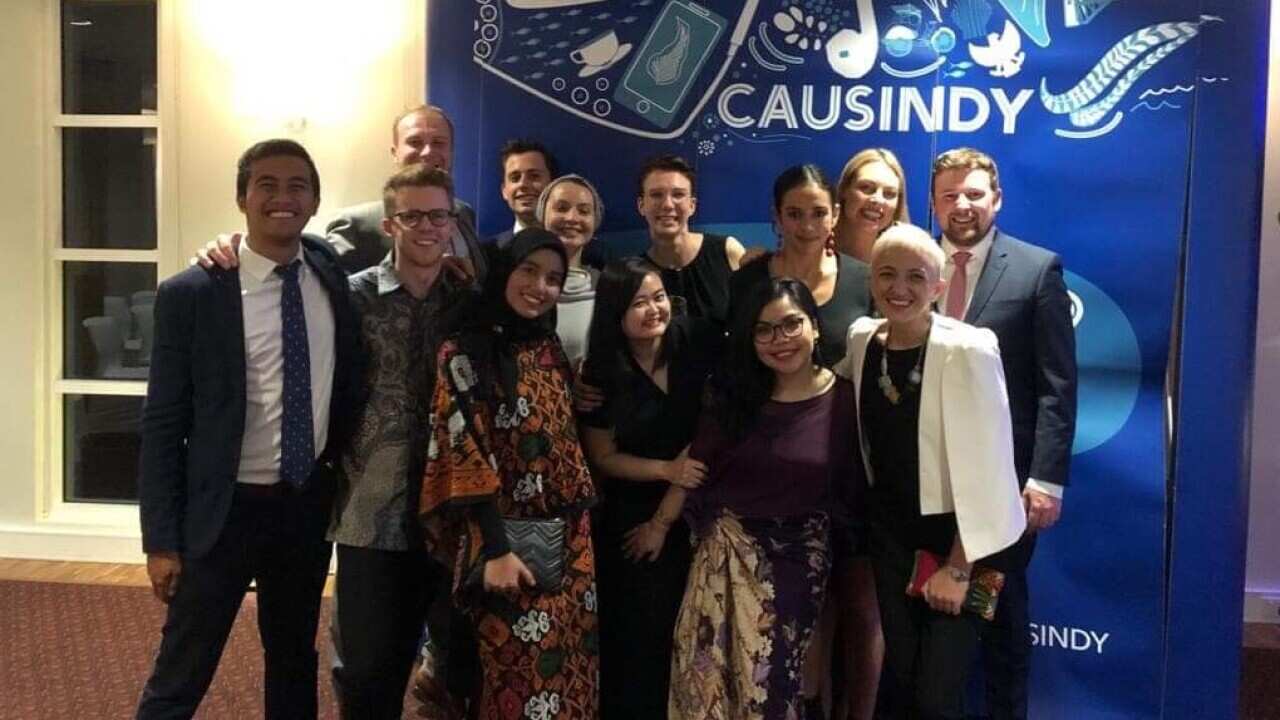 Evelynd, front row 3rd from the left, with the CAUSINDY 2019 board, Darwin April 28.