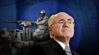 John Howard looks stern, and an Australian special forces soldier firing a weapon.