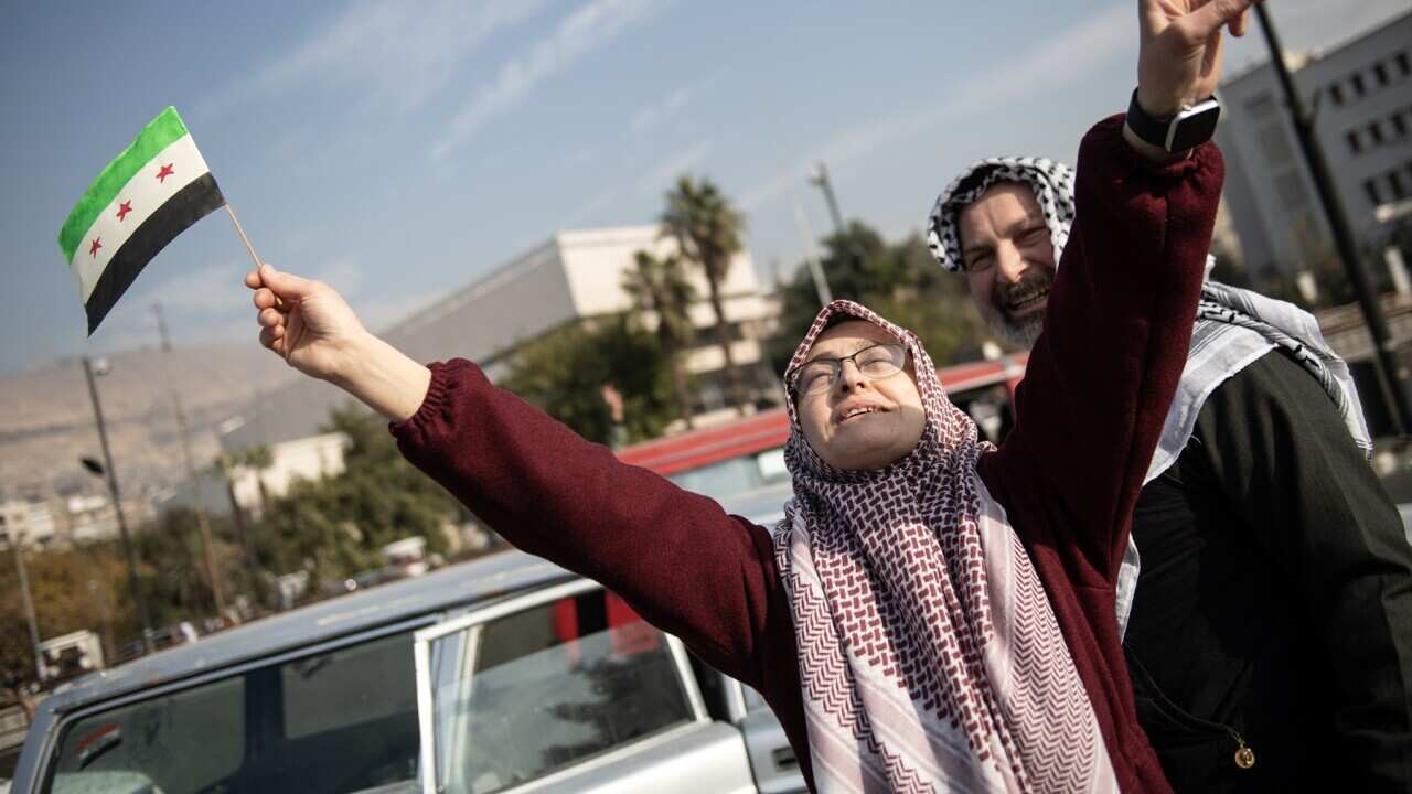 Celebrations in Damascus after rebels capture the city and overthrow al-Assad