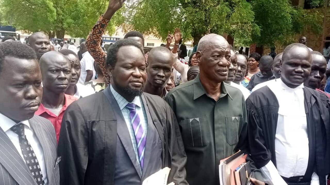 Hon Kuel with her lawyers.jpg