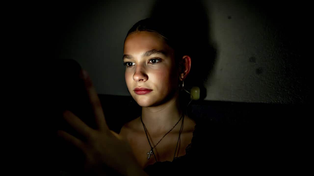 A teenage girl on her cell phone