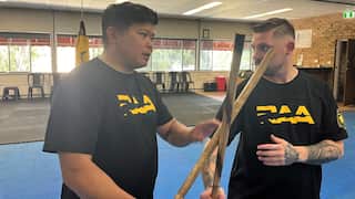 David Bardos (left), Head Instructor of Riverina Arnis Association, demonstrates arnis, a Filipino martial art.