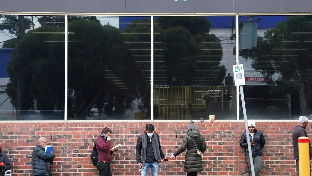 People queueing outside a Centrelink office in Melbourne.
