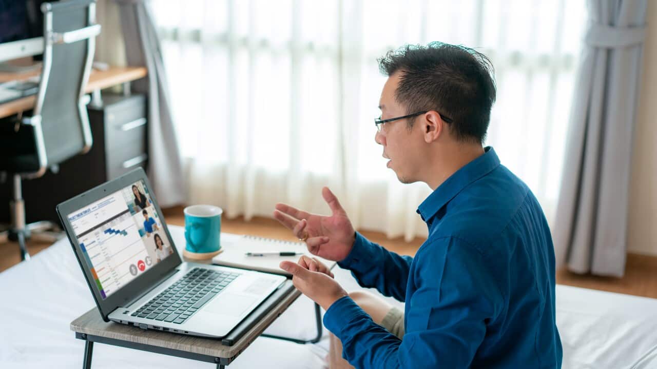 Meeting online in bedroom at home