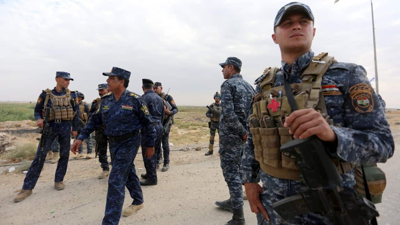 Iraqi federal police forces take up position in Rashad town, southern Kirkuk.
