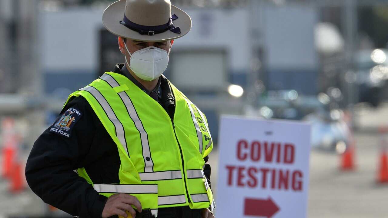 A New York state trooper at a testing facility in Brooklyn, NY