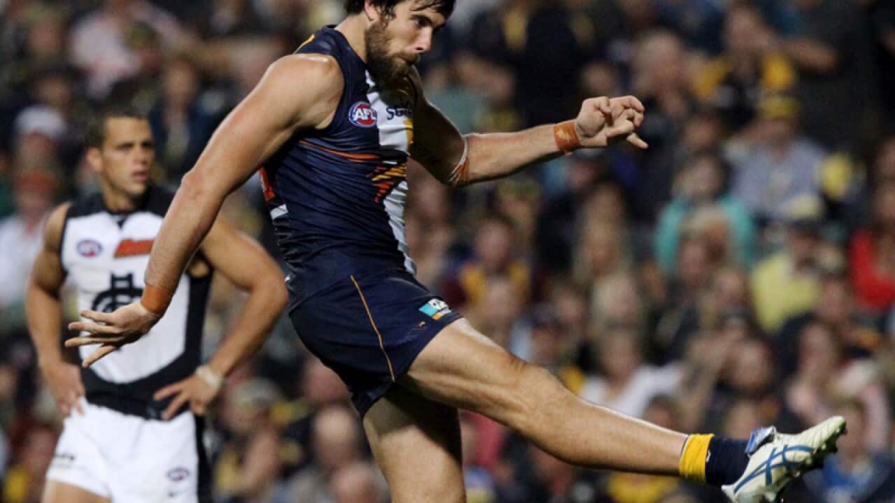 West Coast player Josh Kennedy kicks a goal