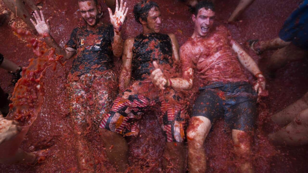 Young men taking part in the Tomatina festival in Spain