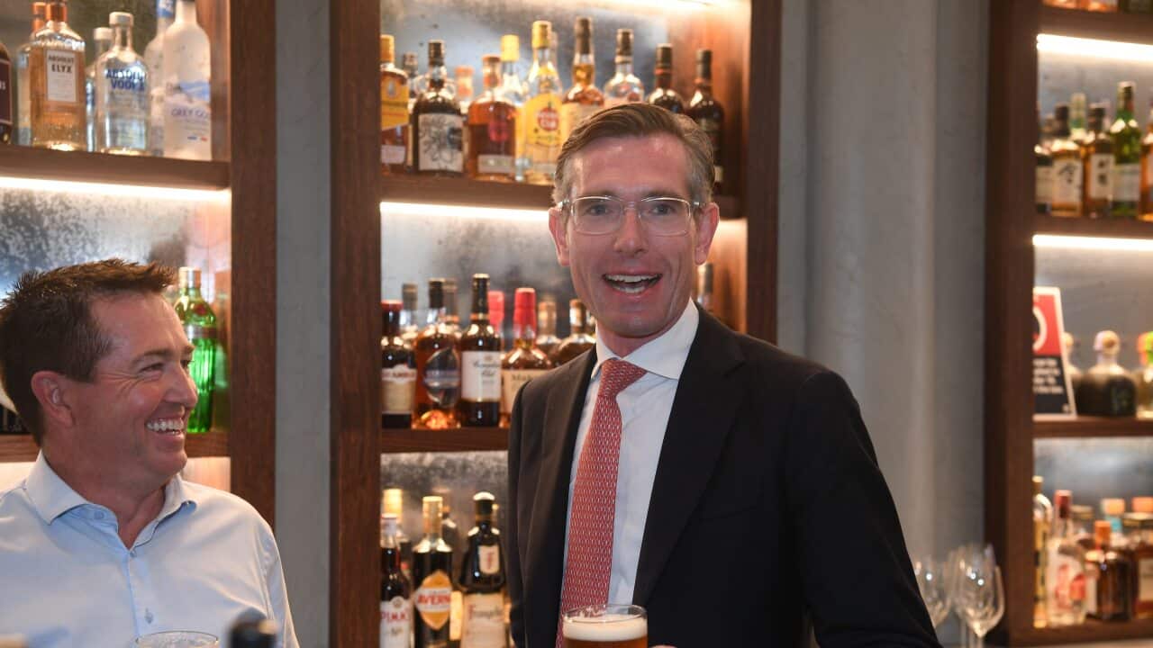 NSW Premier Dominic Perrottet and NSW Deputy Premier Paul Toole enjoy a beer at Watson’s Pub in Sydney, Monday, October 11, 2021. (AAP Image/Dean Lewins) NO ARCHIVING