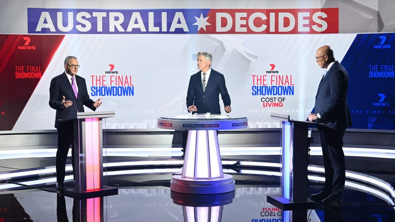 Anthony Albanese and Peter Dutton stand at separate podiums separated by a moderator.