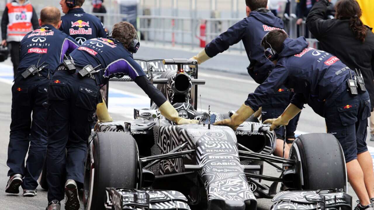 Red Bull driver Daniel Ricciardo is pushed into the pits