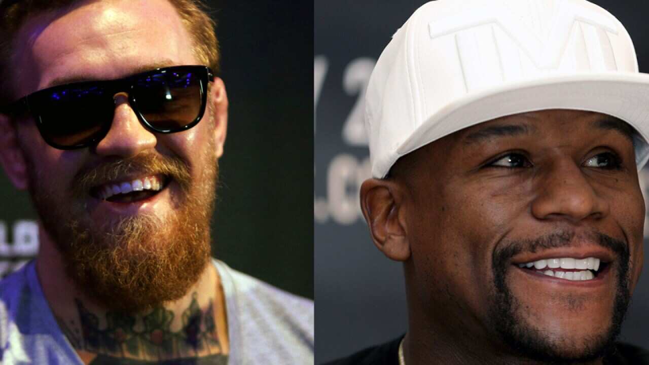 Floyd Mayweather (l) Conor McGregor (r)
