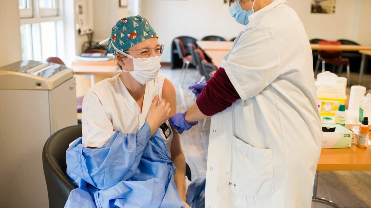 Medical staff at a Paris hospital receive the Astra Zeneca vaccine