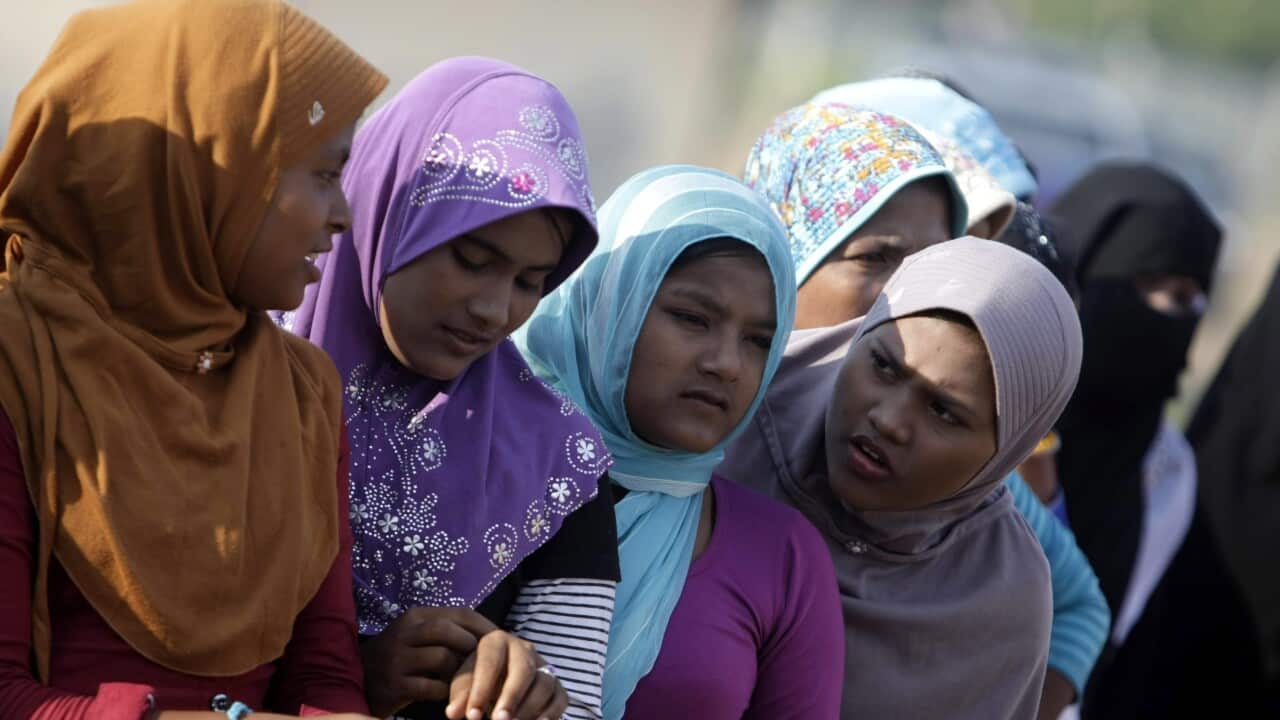  women queue for their breakfast North Aceh, Indonesia(EPA/HOTLI SIMANJUNTAK)