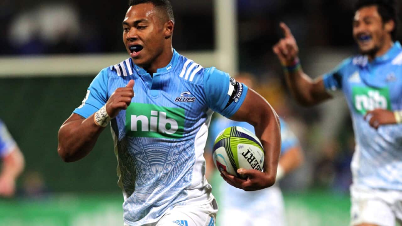 Tevita Li of the Blues runs to score a try