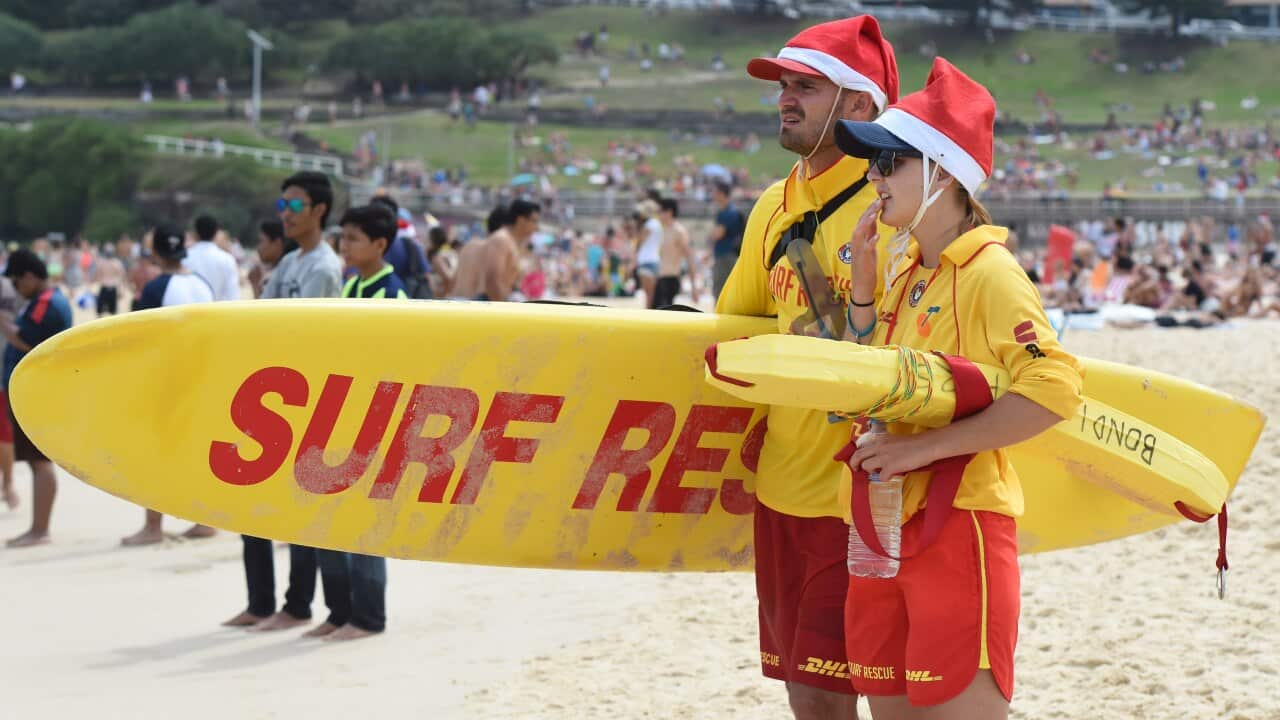 Surf Life Savers monitor swimmers and conditions at Bondi Beach in Sydney.