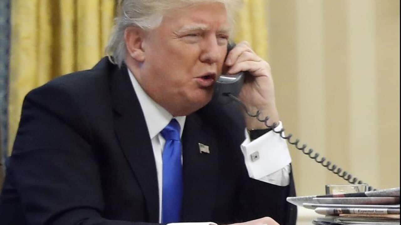 US President Donald Trump on the phone