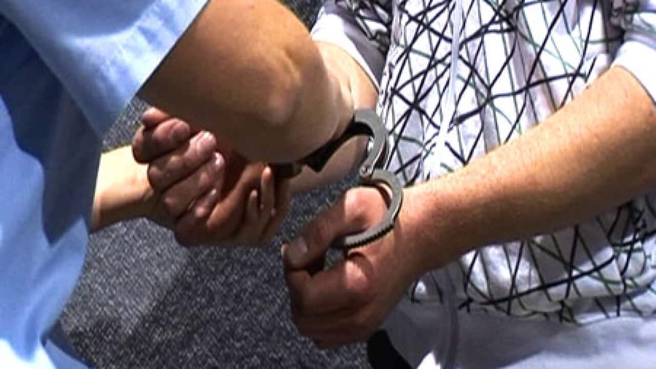 handcuffs_arrest_police_2603_B_aap_71879118