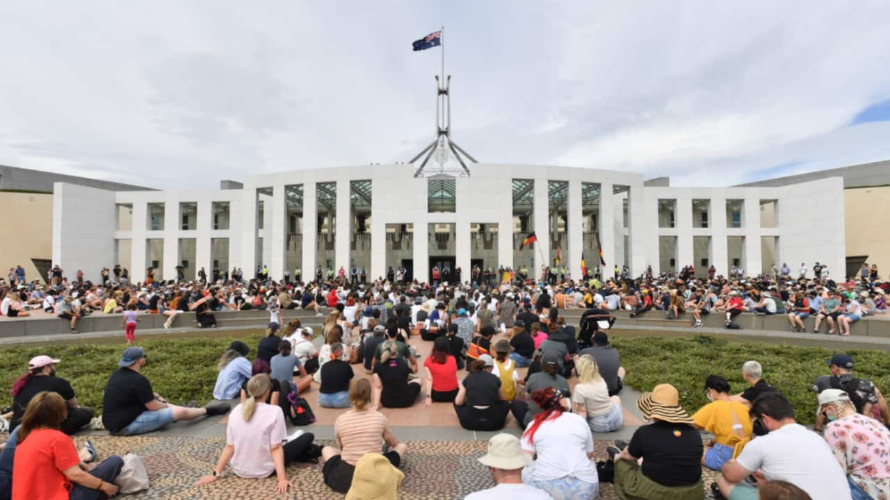 Protesters during an Invasion Day rally in front of Parliament House in Canberra.