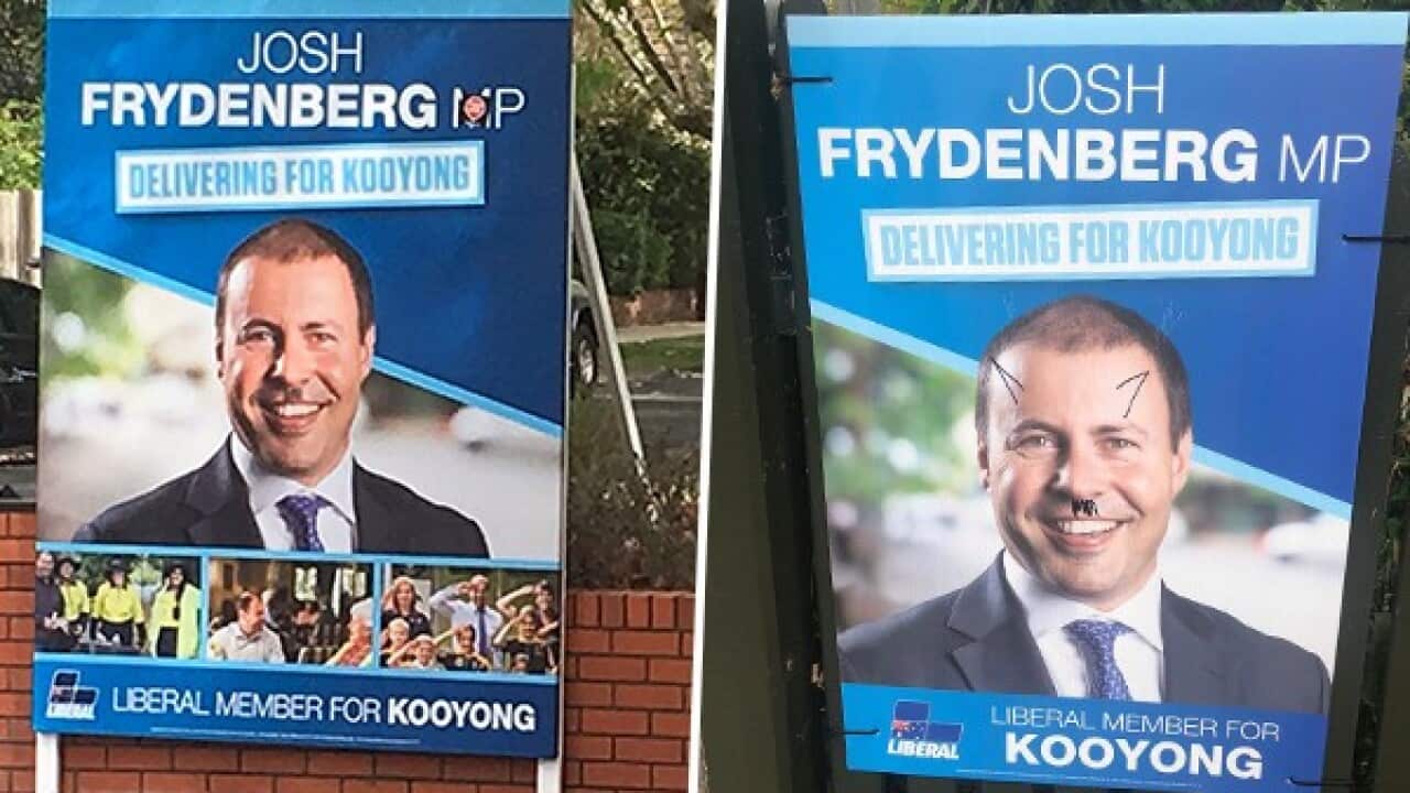 Two of the vandalised posters.
