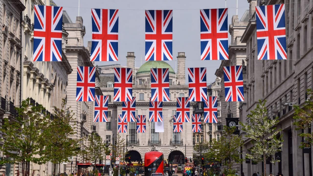 Union jacks hanging above a street.