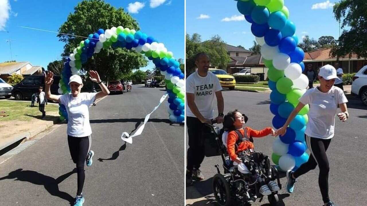 Marija Macri joined by her son Marc and her husband at the finish of 70km marathon