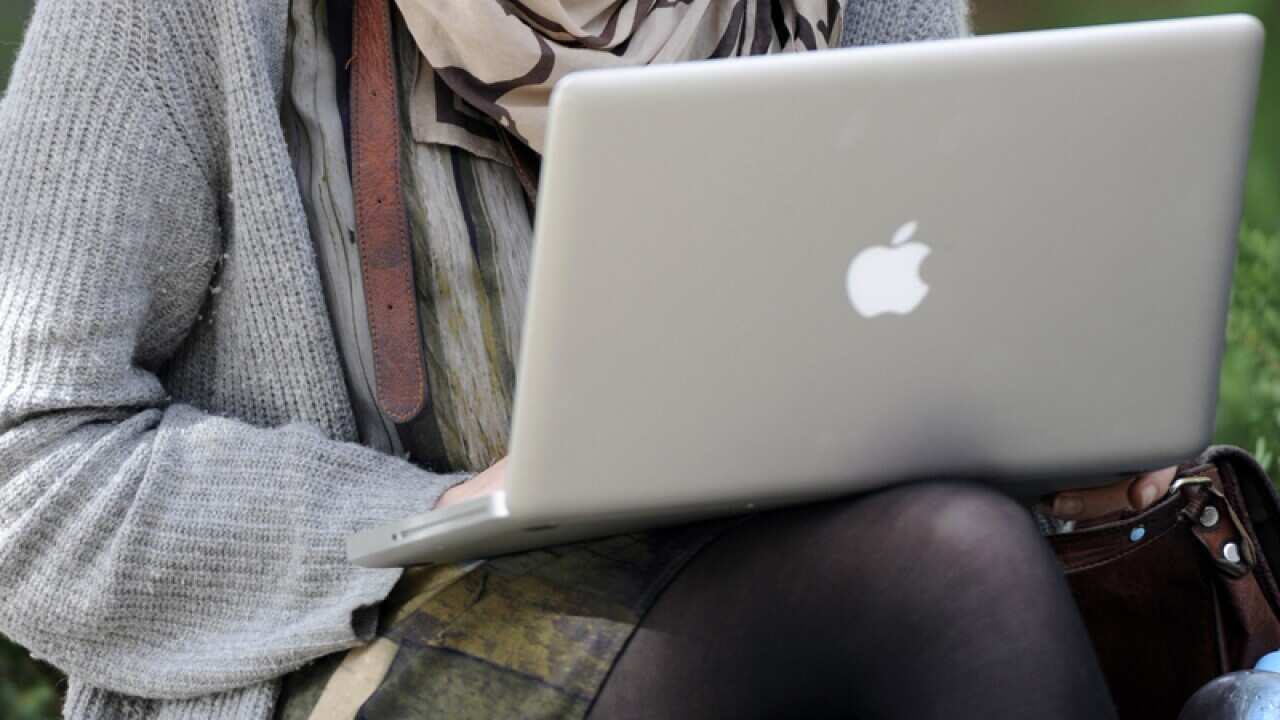 A student with a laptop