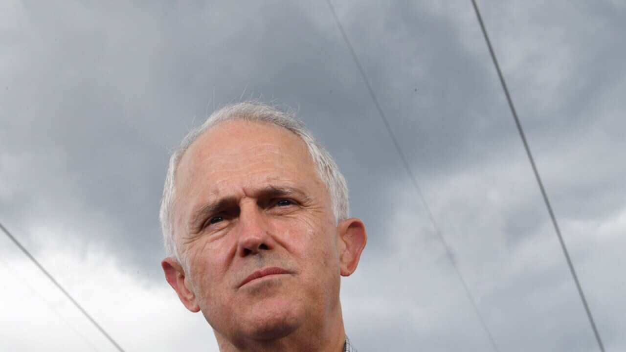 Power lines are seen above Australia's Prime Minister Malcolm Turnbull