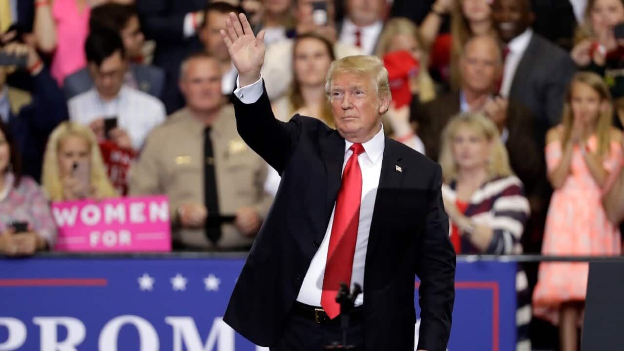 President Donald Trump waves to the crowd at a rally Tuesday, May 29, 2018, in Nashville, Tenn.