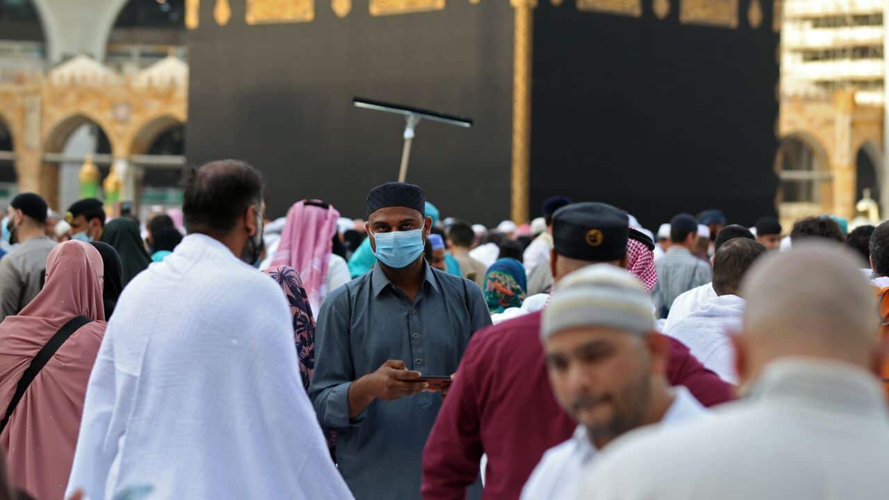 Muslim pilgrims wear masks at the Grand Mosque in Saudi Arabia's holy city of Mecca.