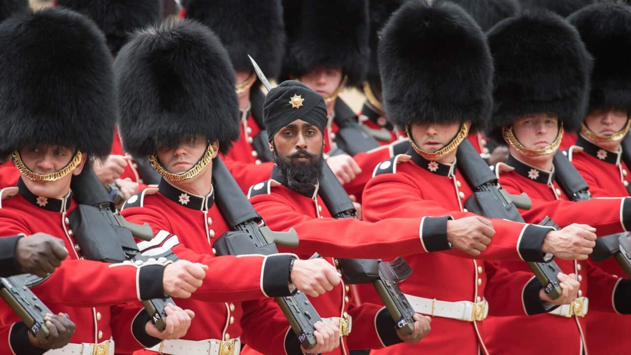 A Sikh member of the Coldstream Guards wearing a turban as he takes part in the Colonel's Review
