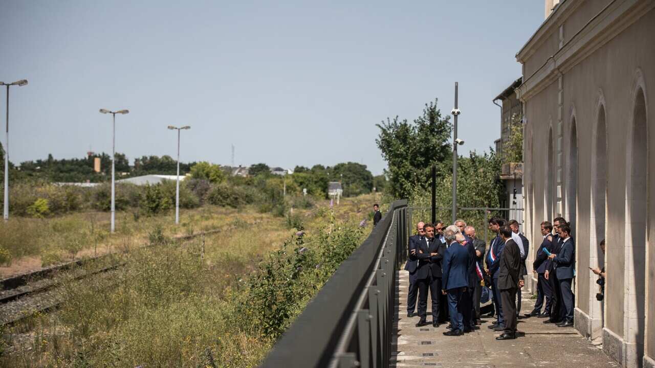 French President Emmanuel Macron visits the newly inaugurated Shoah memorial at the former Pithiviers' train station