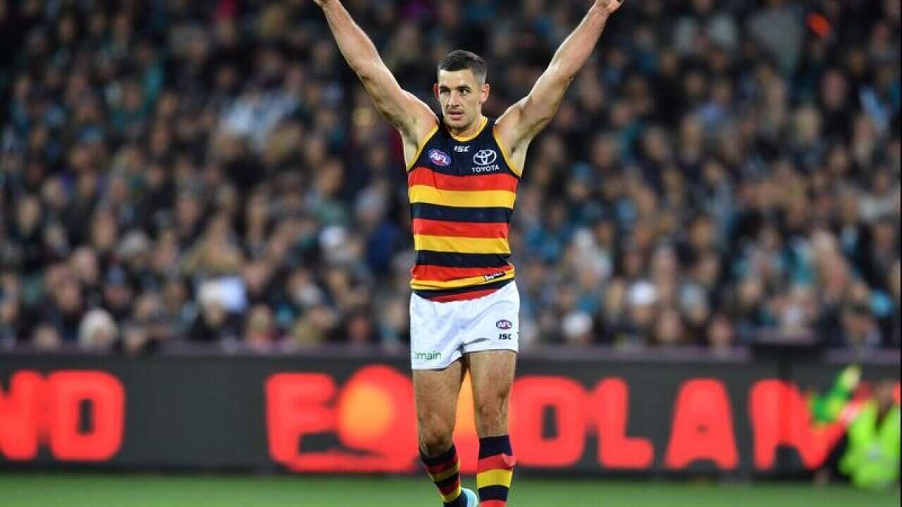 Taylor Walker of the Crows reacts after scoring a late goal