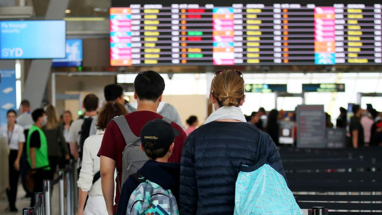 People lining up to go through airport security