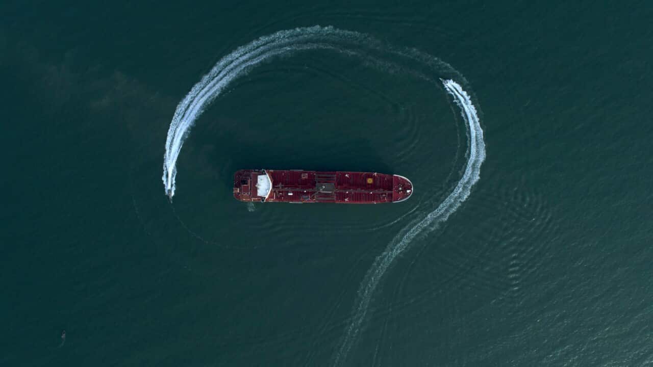 Speedboats from Iran's Revolutionary Guard circle a British-flagged oil tanker
