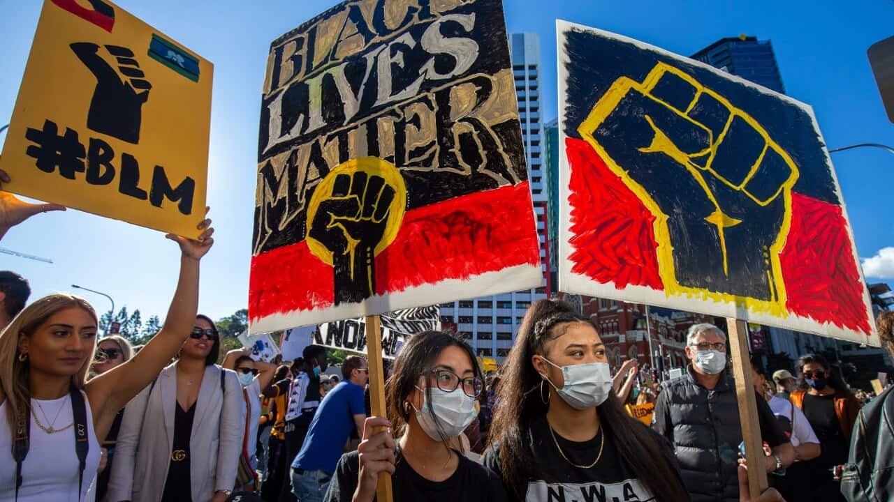 Protesters participate in a Black Lives Matter rally in Brisbane, Saturday, June 6, 2020.