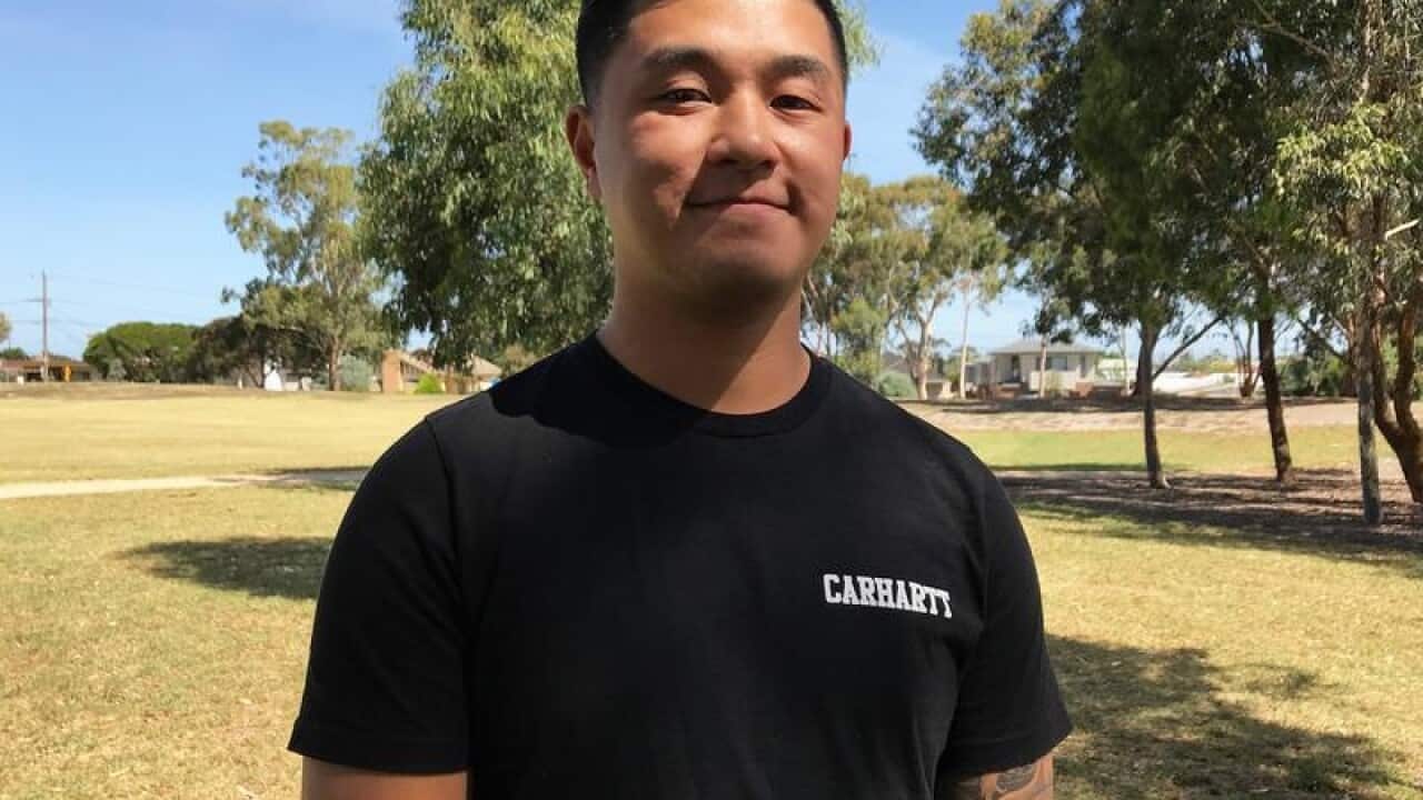 Electrician Brandon Phan poses for a photo in Melbourne.