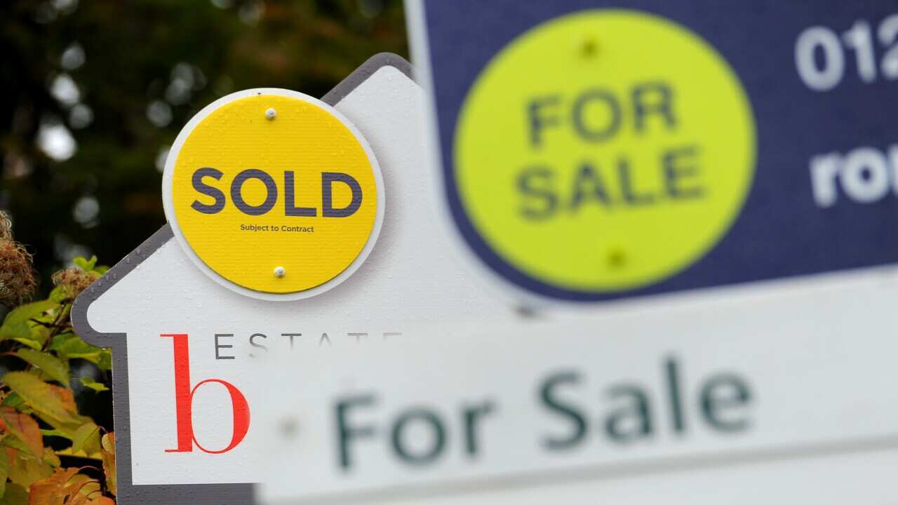 General view of Sold and For Sale signs outside a block of flats in Basingstoke, hampshire