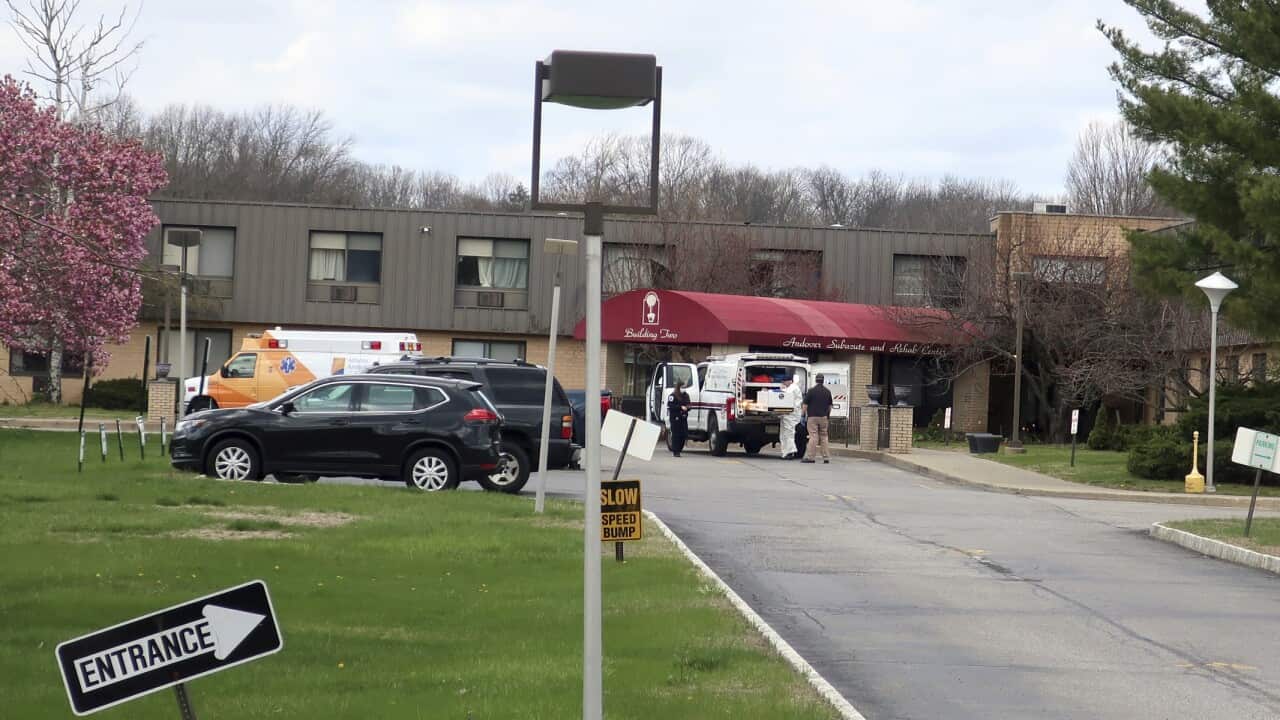 Ambulance crews outside Andover Subacute and Rehabilitation Center in Andover, New Jersey.